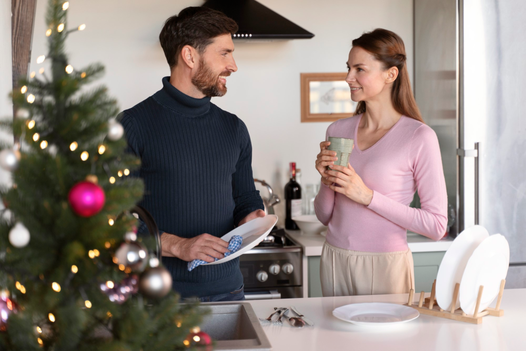 couple doing the dishes following these Greenville Affordable Plumber Tips for the Holidays
