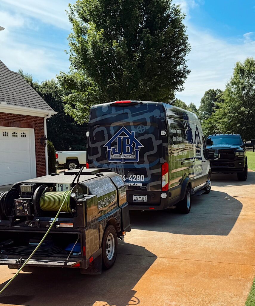 Back to School Plumbing Tips: Keeping Your Greenville Home in Top Shape with JB Plumbing Services - JB Plumbing Van with trailer in front of a home in upstate sc