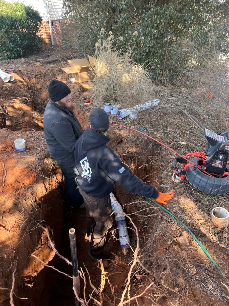 JB Plumbing team working on a main sewer or water line
