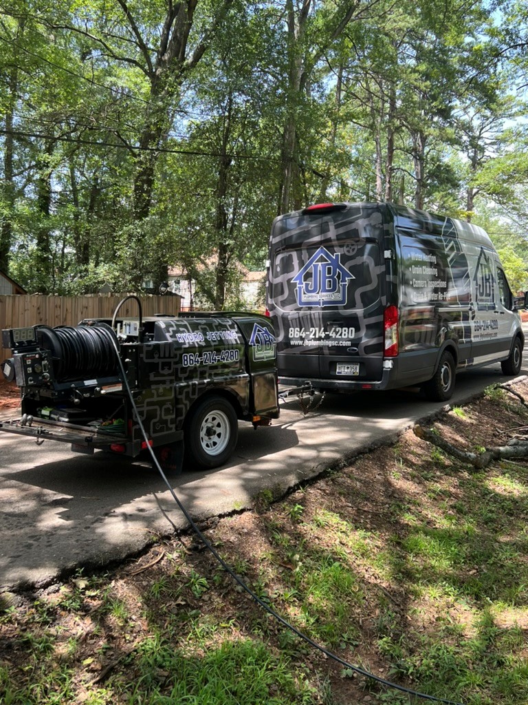 jb plumbing truck with drain cleaning trailer